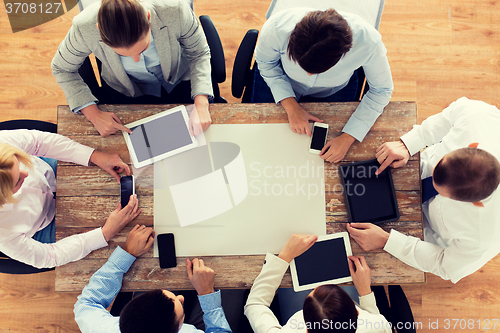 Image of business team with smartphones and tablet pc