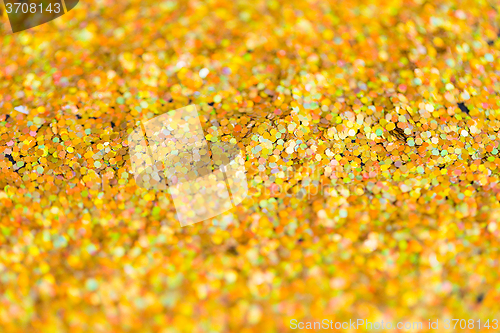 Image of golden glitter or yellow sequins background