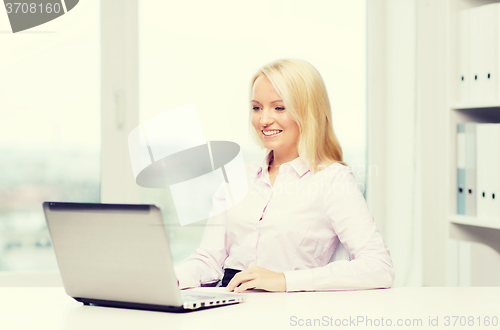 Image of smiling businesswoman or student with laptop