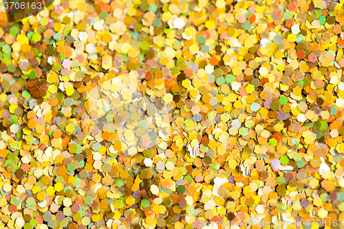 Image of golden glitter or yellow sequins background