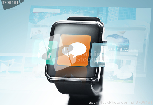 Image of close up of black smart watch with messenger icon