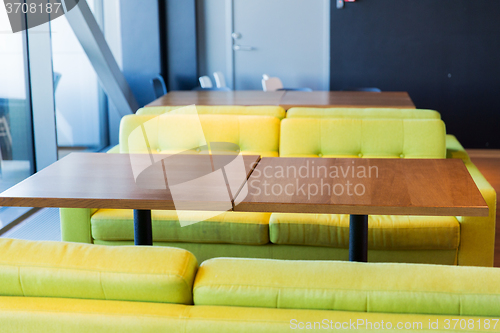 Image of restaurant interior with table and sofas