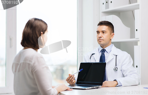 Image of doctor and young woman meeting at hospital