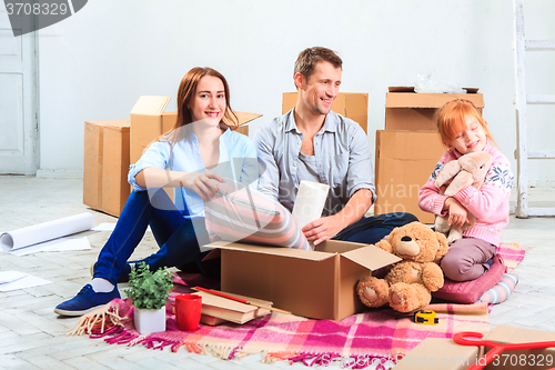 Image of The happy family  during repair and relocation