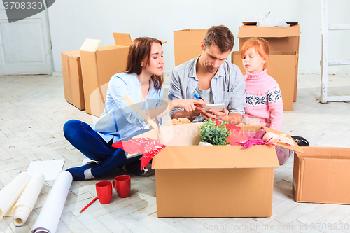 Image of The happy family  during repair and relocation