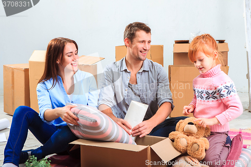 Image of The happy family  during repair and relocation