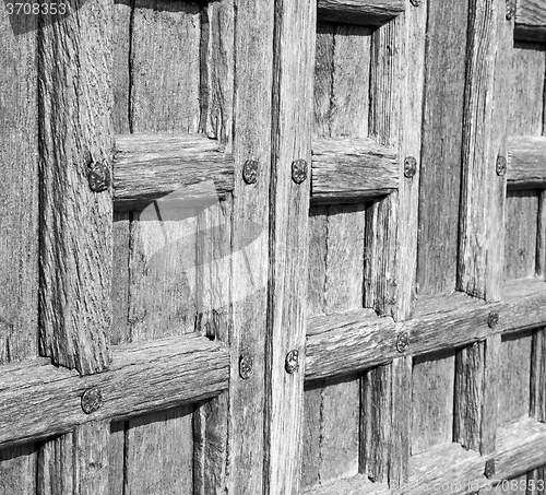 Image of door    in italy old ancian wood and traditional  texture nail