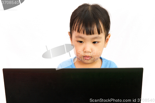 Image of Chinese little girl using laptop