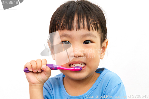 Image of Chinese little girl brushing teeth