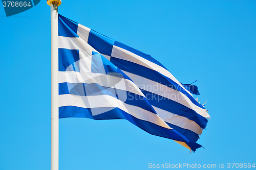 Image of waving greece flag in the blue sky  flagpole