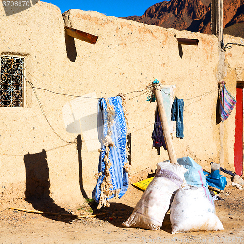 Image of bags  roof  moroccan old wall and brick in antique city