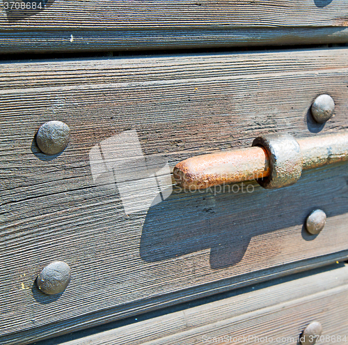 Image of europe old in  italy  antique close brown door and rusty lock  c