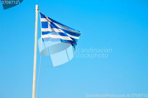 Image of waving greece flag in the blue sky   flagpole