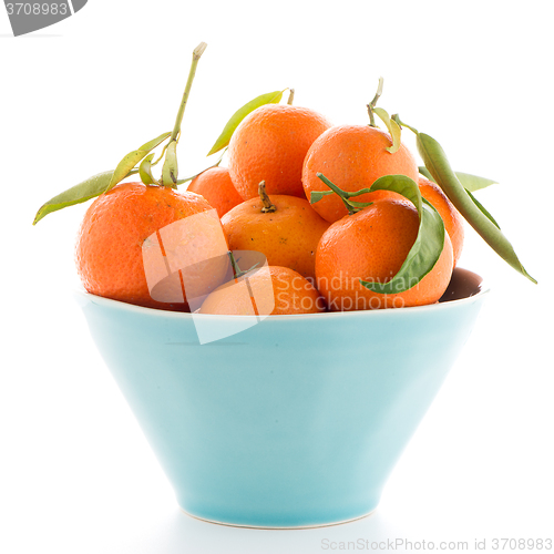 Image of Tangerines on ceramic blue bowl 