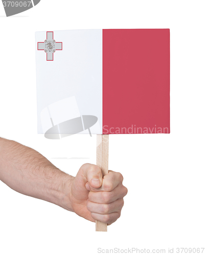 Image of Hand holding small card - Flag of Malta