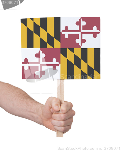 Image of Hand holding small card - Flag of Maryland