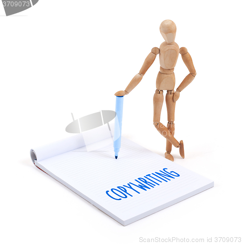 Image of Wooden mannequin writing - Copywriting