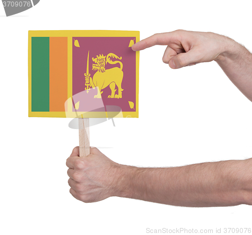 Image of Hand holding small card - Flag of Sri Lanka