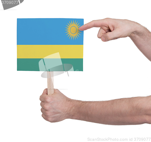 Image of Hand holding small card - Flag of Rwanda