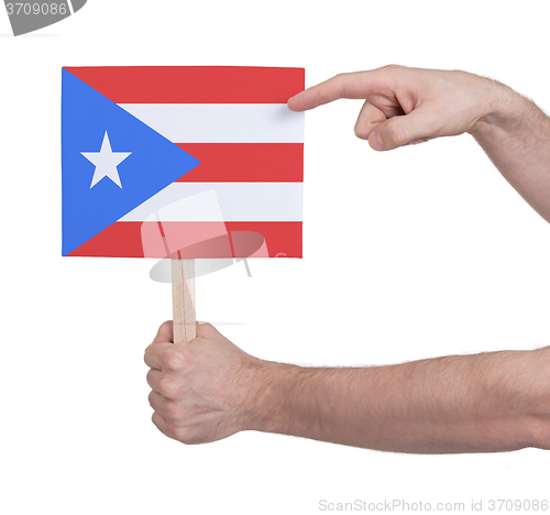 Image of Hand holding small card - Flag of Puerto Rico