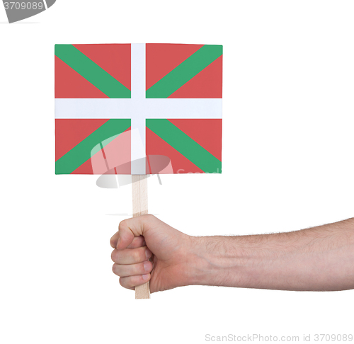 Image of Hand holding small card - Flag of Basque Country