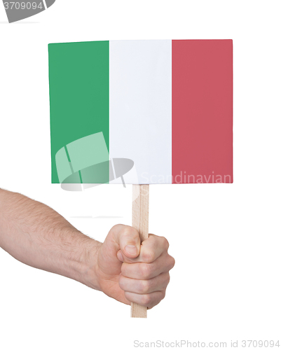 Image of Hand holding small card - Flag of Italy