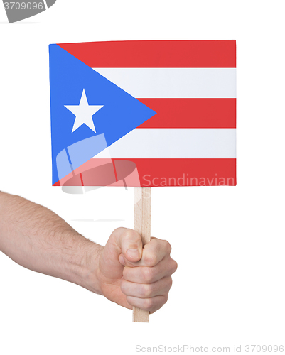 Image of Hand holding small card - Flag of Puerto Rico