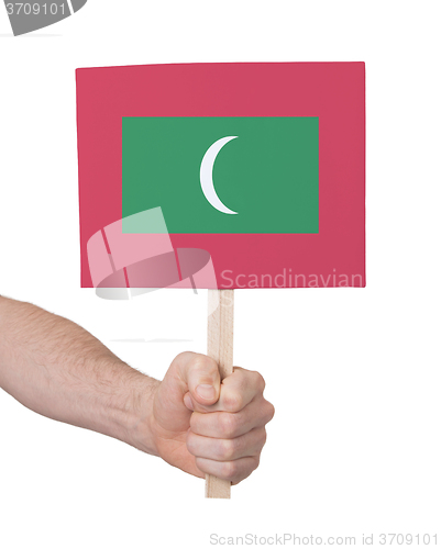 Image of Hand holding small card - Flag of Maldives