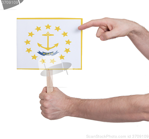 Image of Hand holding small card - Flag of Rhode Island