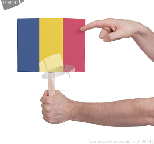 Image of Hand holding small card - Flag of Romania