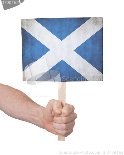 Image of Hand holding small card - Flag of Scotland