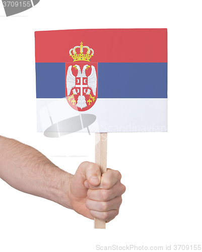 Image of Hand holding small card - Flag of Serbia