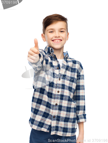 Image of smiling boy in checkered shirt showing thumbs up