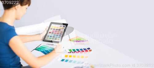 Image of woman working with color samples for selection