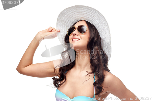 Image of happy young woman in bikini swimsuit and sun hat