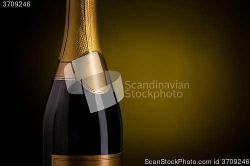 Image of close up of champagne bottle with blank label
