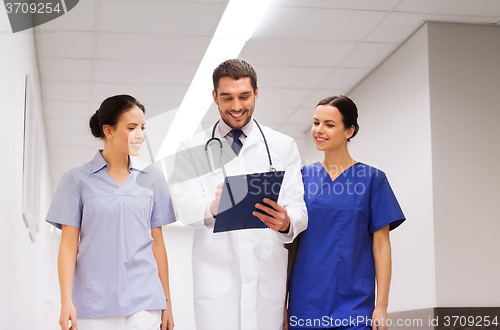 Image of group of medics at hospital with clipboard