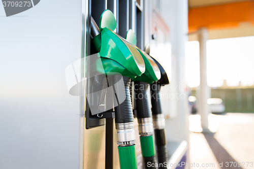 Image of close up of gasoline hose at gas station