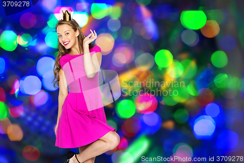 Image of happy young woman or teen girl in princess crown