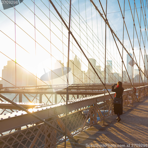 Image of Brooklyn bridge at sunset, New York City.