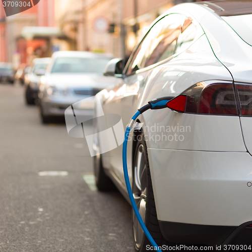 Image of Electric Car in Charging Station.