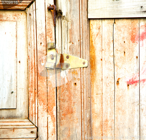 Image of brown  morocco in africa the old wood  facade home and rusty saf