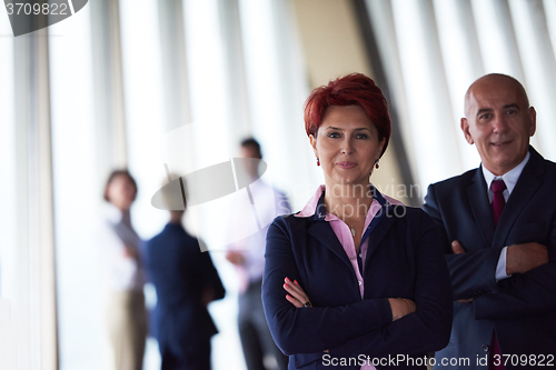 Image of diverse business people group with redhair  woman in front