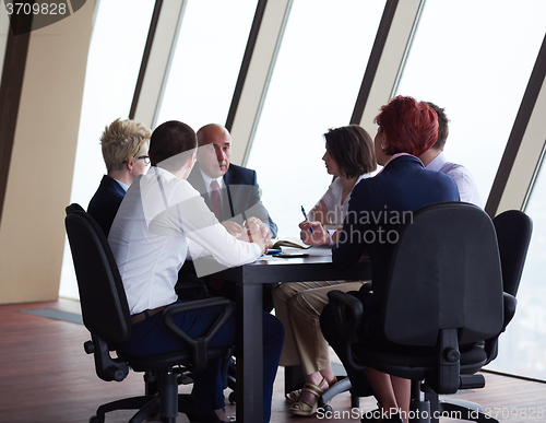 Image of business people group on meeting at modern bright office