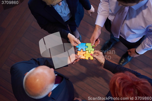 Image of assembling jigsaw puzzle