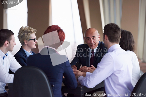 Image of business people group on meeting at modern bright office