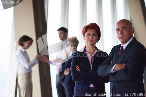 Image of diverse business people group with redhair  woman in front
