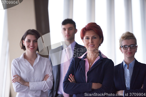 Image of diverse business people group with redhair  woman in front