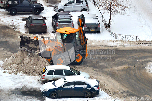 Image of Cleaning of snow from city streets by means of special equipment