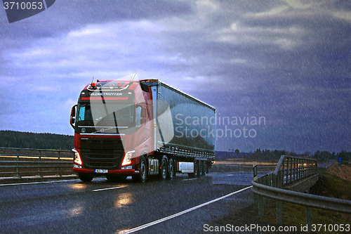 Image of Red Volvo FH Semi and Dark Sky